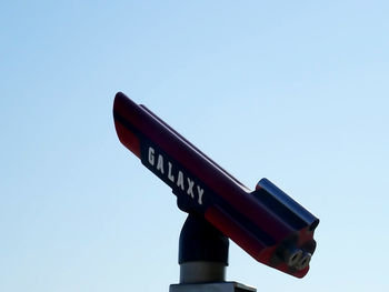 Low angle view of information sign against clear sky