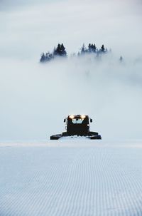 View of car on snow covered land