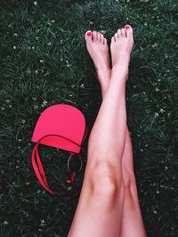 Low section of woman feet on grass