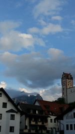 Low angle view of house against cloudy sky