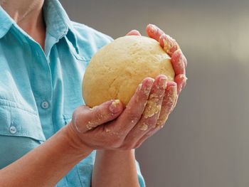 Close-up of man preparing food in kitchen counter