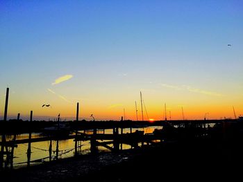 Silhouette of boats at sunset