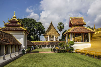 View of temple building against cloudy sky