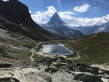 Scenic view of snowcapped mountains against sky