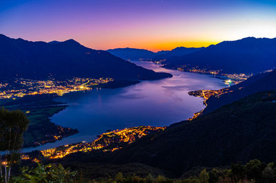 Lake como, photographed by gera lario, in the evening. view of towns and the upper lake mountains.