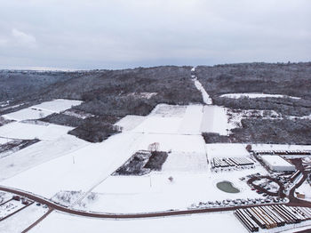 High angle view of snow covered landscape against sky