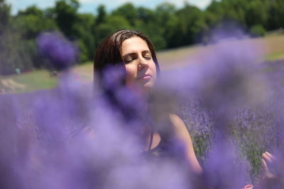 Close up of woman in purple flowers