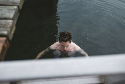 Man swimming in lake