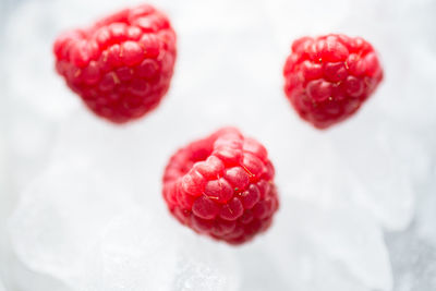Close-up of strawberry over heart shape