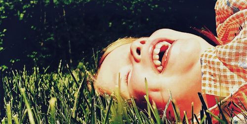 Midsection of woman lying down on land