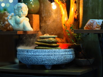 Close-up of burning candles in temple