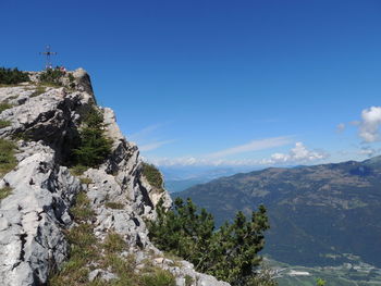 Scenic view of mountains against clear blue sky