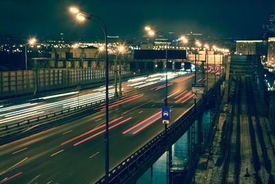 Cars moving on city street at night