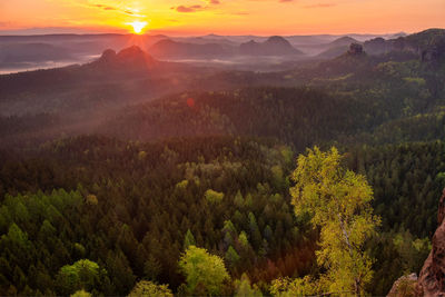 Autumn sunrise, saxon switzerland. fantastic colorful sunrise on the top of the rocky mountain 