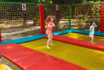 Portrait of young woman exercising in pool