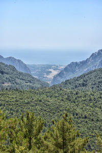 Scenic view of landscape and mountains against sky