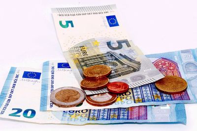 Close-up of coins on paper