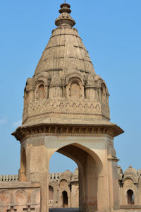 Low angle view of historical building against clear blue sky