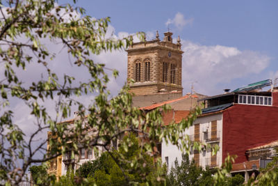 Low angle view of building in town against sky