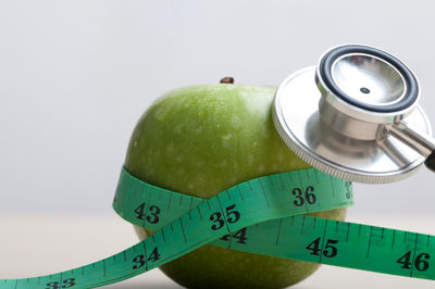 Close-up of apple over white background
