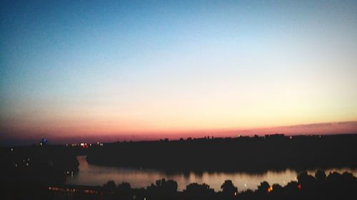 Scenic view of lake at sunset