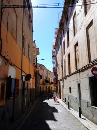 Street amidst buildings in city against sky