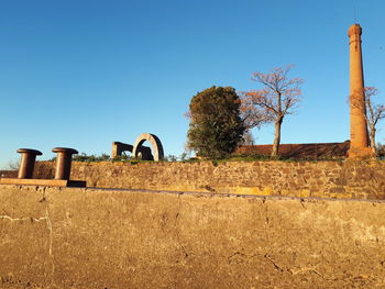 Old ruin against clear blue sky