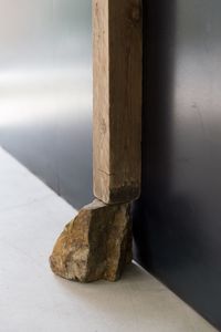 Close-up of wood on table against wall