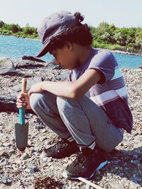 Full length of girl sitting on beach