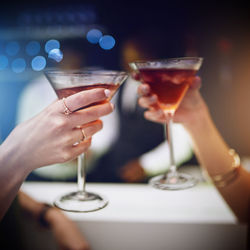 Cropped hand of woman holding wineglass