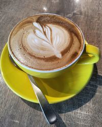 Close-up of cappuccino on table
