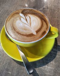 Close-up of coffee cup on table