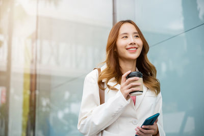 Young woman using mobile phone