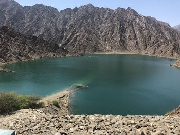 Scenic view of lake by mountains