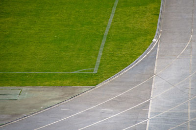 High angle view of playing field by running track on field