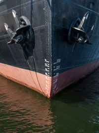 Close-up of boat moored in water