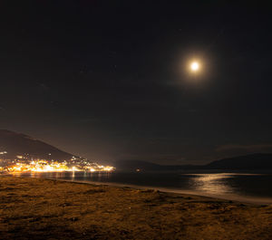 Scenic view of sea against sky at night