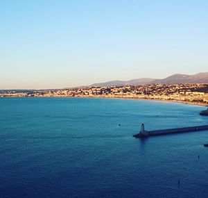 Scenic view of sea against clear blue sky