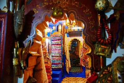 High angle view of illuminated lanterns hanging in temple outside building