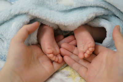 Cropped image of newborn baby