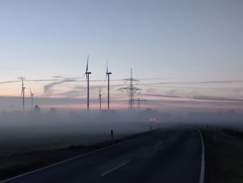 Scenic view of road against sky during sunset