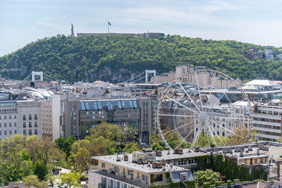 High angle view of buildings in city against sky