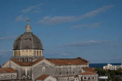 View of buildings in city against sky