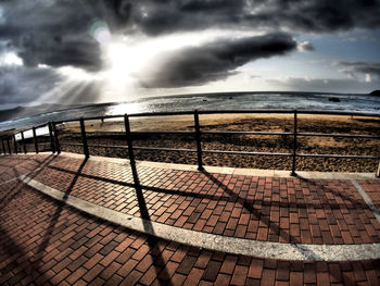 Scenic view of sea against storm clouds