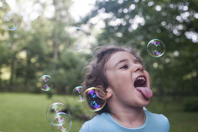 Portrait of happy boy with bubbles