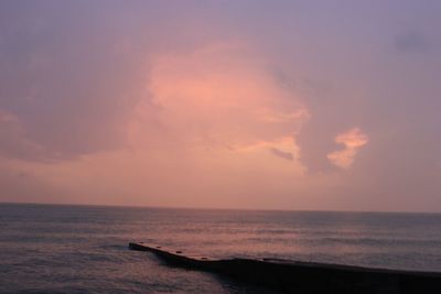 Scenic view of sea against sky at sunset