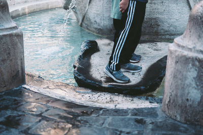 Low section of man working in water
