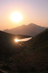 Scenic view of mountains against sky during sunset