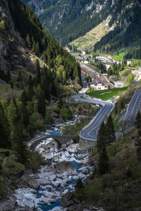 High angle view of winding road amidst trees