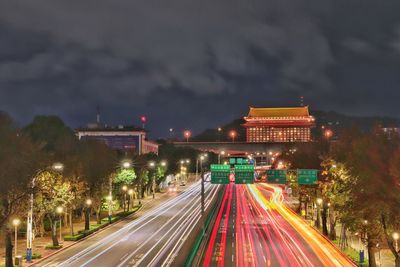 High angle view of light trails on road at night